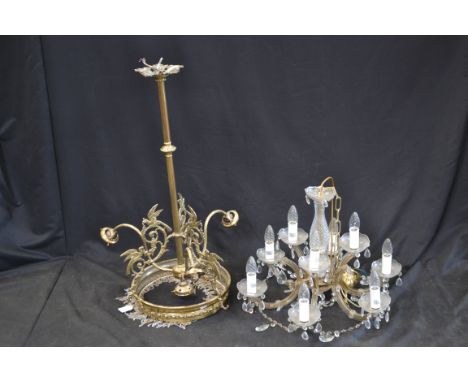 A Regency style brass four light ceiling lamp, decorated with stylized Phoenixes;  a six branch, nine light, electrolier (2()