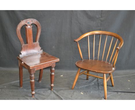 An Ercol child's chair; a mahogany hall chair (2)