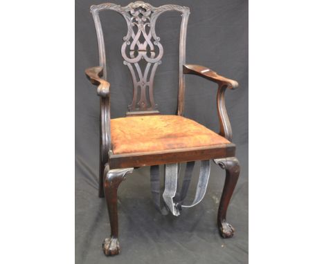 A George III Chippendale style mahogany armchair, ball and claw feet