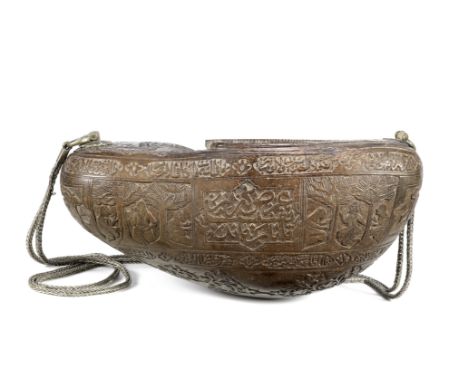 A Qajar coco de mer kashkul Persia, 19th Centuryof typical form, profusely engraved with cartouches containing inscriptions i
