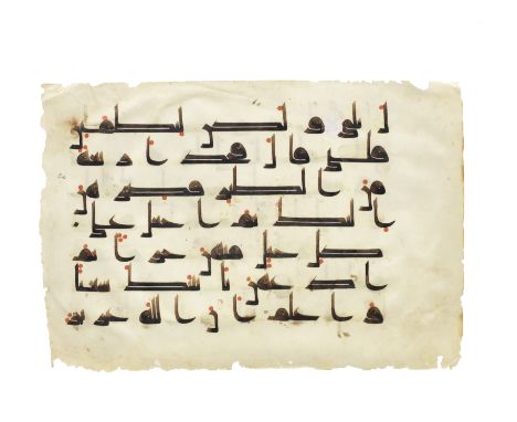 A Qur'an leaf written in kufic script on vellum Near East or North Africa, 9th CenturyArabic manuscript on vellum, 7 lines to