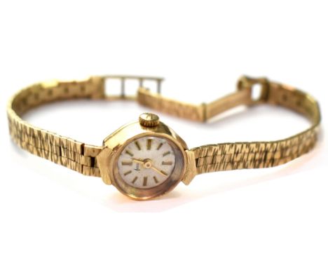Accurist; a ladies' vintage 1970s 9ct gold wristwatch with crown wound movement, the silvered dial set with baton increments,