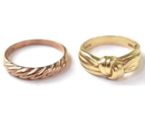 Two 9ct gold rings to include a 9ct rose gold half twist design, size P, and a 9ct yellow gold modern ring with tied knot hea