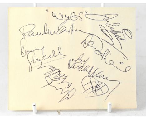 WINGS; a single sheet bearing six signatures including Paul and Linda McCartney, with a further unidentified signature to the