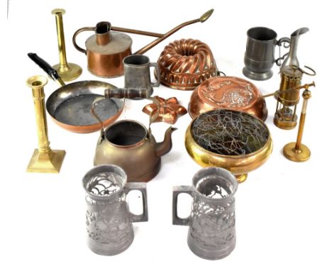 A quantity of mixed metalware to include various copper jelly moulds, watering can, small frying pan, various pewter items, a