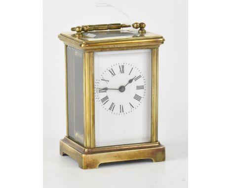 An early 20th century French SF brass carriage clock, the white dial set with Roman and Arabic numerals, height 12cm. CONDITI