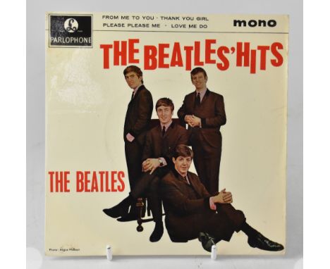 GEORGE HARRISON & GEORGE MARTIN; a 45rpm Beatles Hits single, the reverse inscribed 'Best wishes' and bearing the signature f