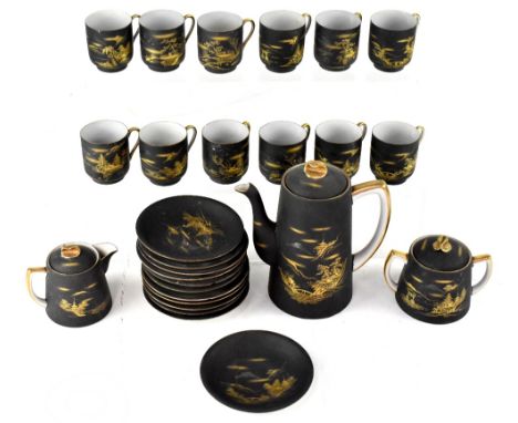 A Japanese coffee service with gilt-heightened decoration against a matte black ground, comprising coffee pot, lidded milk ju