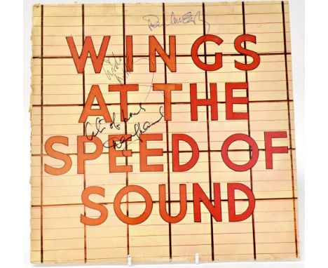WINGS; a cut front section from the 'At the Speed of Sound' album sleeve bearing the signatures of Paul McCartney, Linda McCa