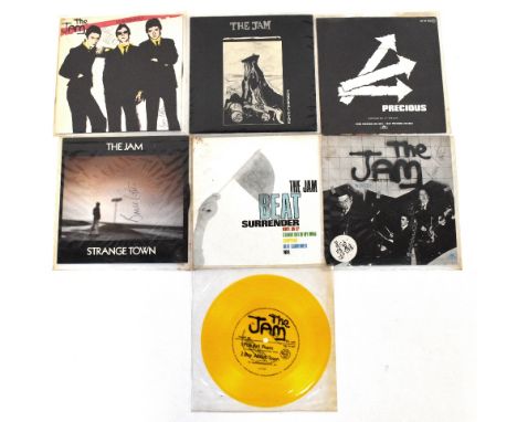 THE JAM; records to include 'Strange Town', 'The Modern World' and 'In The City', bearing the signatures of all three members
