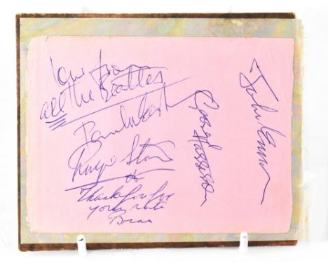THE BEATLES; the back page from an autograph book with stuck-down sheet bearing all four signatures of The Beatles, Paul McCa