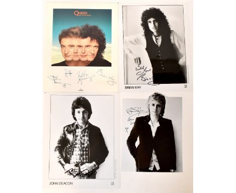 QUEEN; three black and white portrait photographs bearing the signatures of Roger Taylor, Brian May and John Deacon, sold wit
