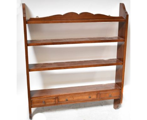 A reproduction mahogany wall-hanging shelf, with three shelves above three small spice drawers, 91 x 76 x 13cm. CONDITION REP