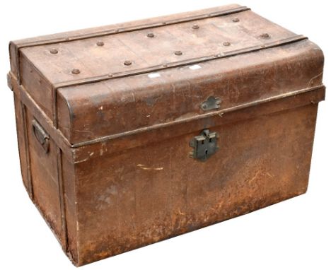 A late 19th century metal travel trunk with studded top and carrying handles containing a quantity of vintage tools to includ
