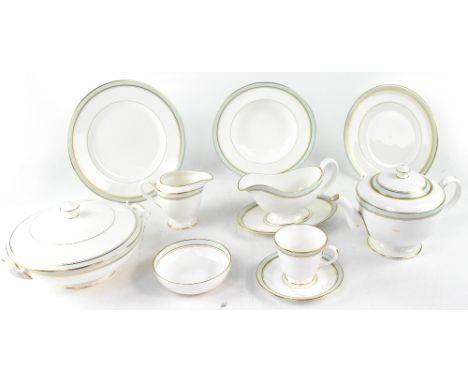 A Royal Worcester 'Howard' part dinner/tea service, white ground with pale duck egg and gilt rim, dated verso 1982, to includ