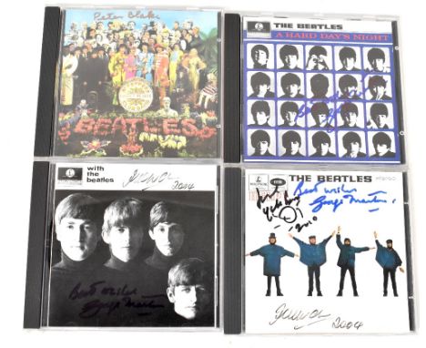 THE BEATLES RELATED; four CDs bearing signatures including Yoko Ono, George Martin and Peter Blake (4).We have not authentica