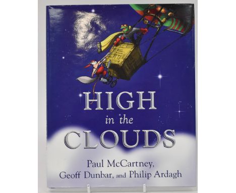PAUL MCCARTNEY; 'High in the Clouds', a single volume with dust jacket bearing signature of the star to the title page. CONDI