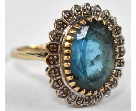 A 9ct gold dress ring set with central blue stone, stamped 375, approx 4.5g. CONDITION REPORT Needs cleaning, no obvious dama