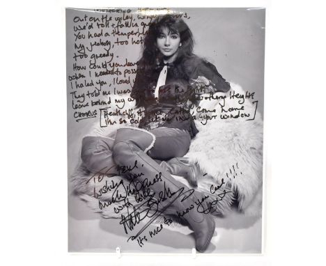 KATE BUSH; a black and white photograph laid on card inscribed 'To Steve, Wishing you much happiness, with love Kate Bush, it