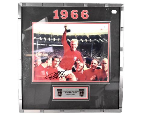 WORLD CUP 1966; a photograph of the England team with Bobby Moore holding aloft the winners' trophy, silvered plaque beneath 