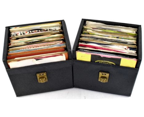 A quantity of 45rpm singles contained within two carrying cases, including Adam and the Ants, Elton John and Kiki Dee, Barry 