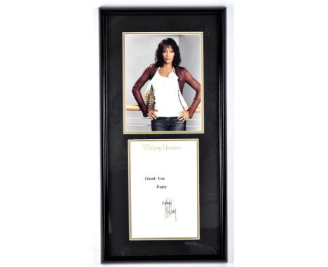 WHITNEY HOUSTON; a photograph and signed note, the three-quarter length portrait above a page 'Whitney Houston, Thank you, En