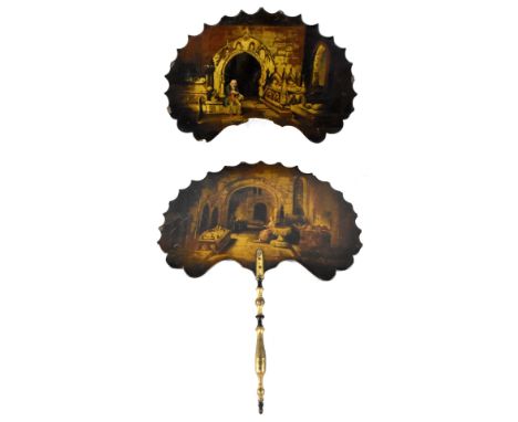 Two 19th century lacquered wood hand fans both decorated with hand painted scenes depicting seated figures within the interio