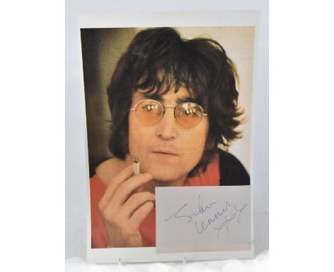 JOHN LENNON; a printed photograph of John Lennon with clipped piece of paper bearing the signature 'John Lennon xxx'. CONDITI