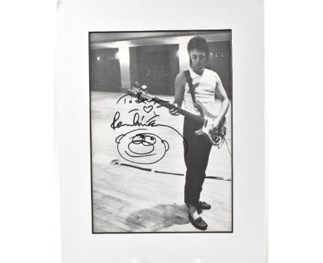 PAUL MCCARTNEY; a printed black and white photograph inscribed 'To Brian' and bearing signature of Paul McCartney beneath a h