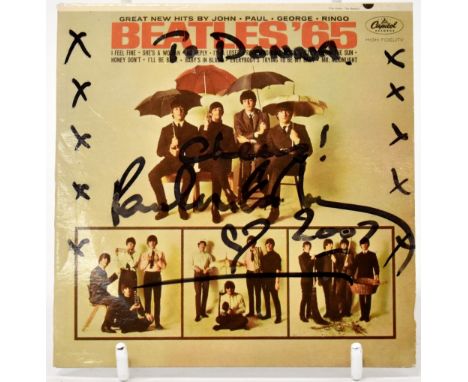 PAUL MCCARTNEY; 'The Beatles 1965' CD, inscribed 'To Donna, Cheers!' and bearing the signature of Paul McCartney with heart, 