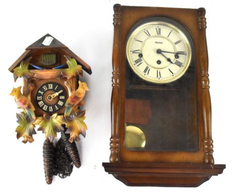 Hermle; a 20th century mahogany cased eight-day wall clock, the white dial set with Roman numerals, height 40cm, and a Bavari