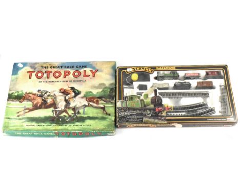 A boxed Palitoy L.N.E.R. Branch Line Freight electric train set and a vintage boxed 'The Great Race Game Totopoly' by the man