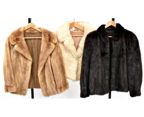 Two vintage c1960s fur jackets, a dark chocolate shade waist-length jacket with balloon sleeves and stand-up collar, a dark h