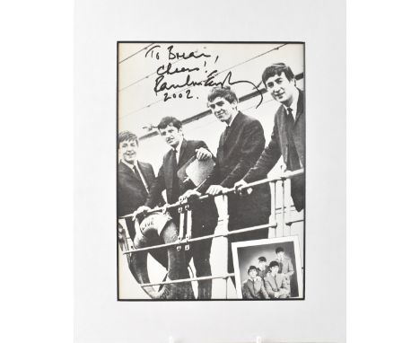 PAUL MCCARTNEY; a printed photograph inscribed 'To Brian, Cheers!' and signed Paul McCartney 2002, 23 x 16.5cm. CONDITION REP