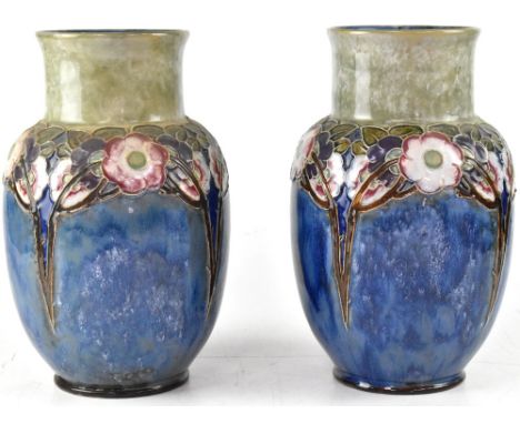 ROYAL DOULTON; a pair of early 20th century baluster vases, blue grey drip glaze with Art Nouveau raised tube-lined decoratio