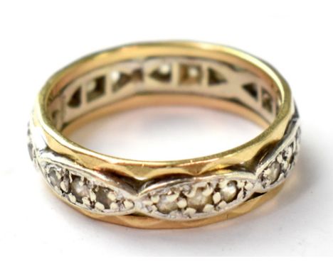 A vintage hallmarked 9ct gold full eternity ring, the repeating groups of four small white stones set in white metal on yello