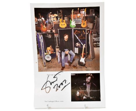 ERIC CLAPTON; a page from a magazine bearing the signature of the star dated 2007, beneath an image of backstage in the 1980s