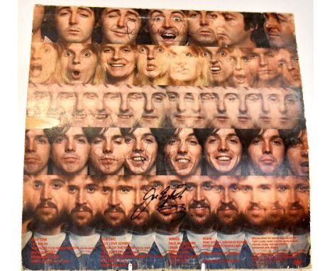 WINGS; the back cover of an album sleeve bearing the signatures of Paul McCartney, Jimmy McCulloch and Joe English.We have no