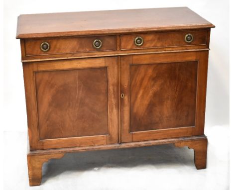 An early 20th century mahogany sideboard with pair of drawers above pair of panelled doors and raised on bracket feet, 90 x 1