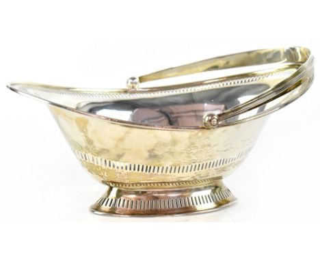 A late Victorian hallmarked silver swing-handled basket of lozenge form, with two pierced bands and spreading oval foot, Herb