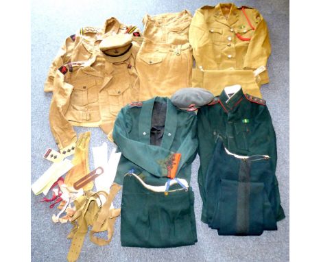 Various British Army uniforms to include two khaki battle dress blouses with Durham Light Infantry cloth badges, pips and lap