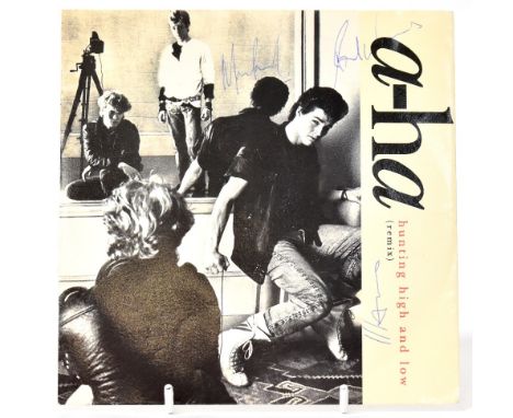 A-HA; a 45rpm single 'Hunting High and Low', bearing two signatures to the sleeve.We have not authenticated these signatures,