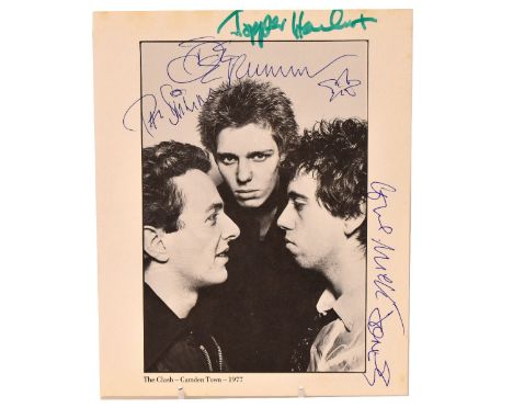 THE CLASH; a page from a book depicting a black and white photograph of the band bearing signatures around the edge.We have n