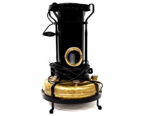 A vintage brass and painted steel Aladdin Paraffin heater, later converted to naturalistic flame light, the LED flame-effect 