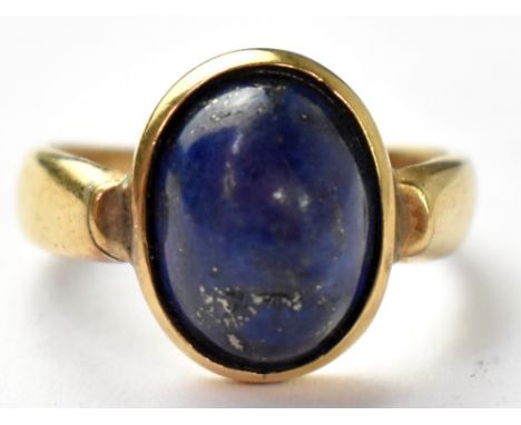 An 18ct gold gentlemen's signet ring with bezel set lapis cabochon, size Q, approx 5.5g. CONDITION REPORT stamped 18k and par