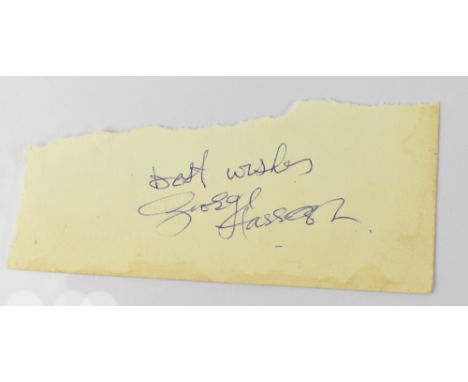 GEORGE HARRISON; a torn scrap of paper bearing the signature of George Harrison and inscribed 'Best wishes'. CONDITION REPORT