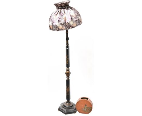 An early 20th century Japanese black lacquer standard lamp, tapering hexagonal column to stepped circular and hexagonal base 