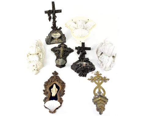 A group of 19th century Roman Catholic church stoups to include four French treen examples, one with original paper label ver