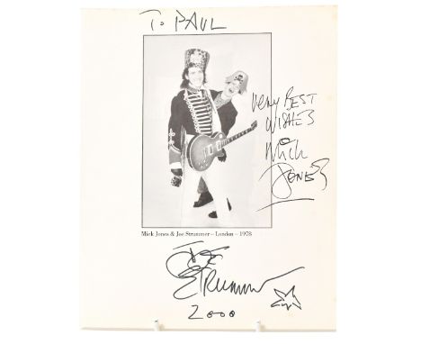 MICK JONES & JOE STRUMMER; a page from a book bearing signatures of both stars, inscribed 'To Paul, Very best wishes' and dat