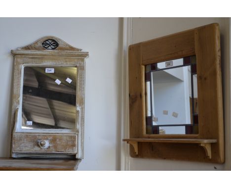 A 20th century pine framed mirror with stained glass surround; another, with drawer to base (2)